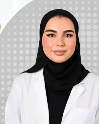 Portrait of Dr. Fatema Al Alawi in a white coat